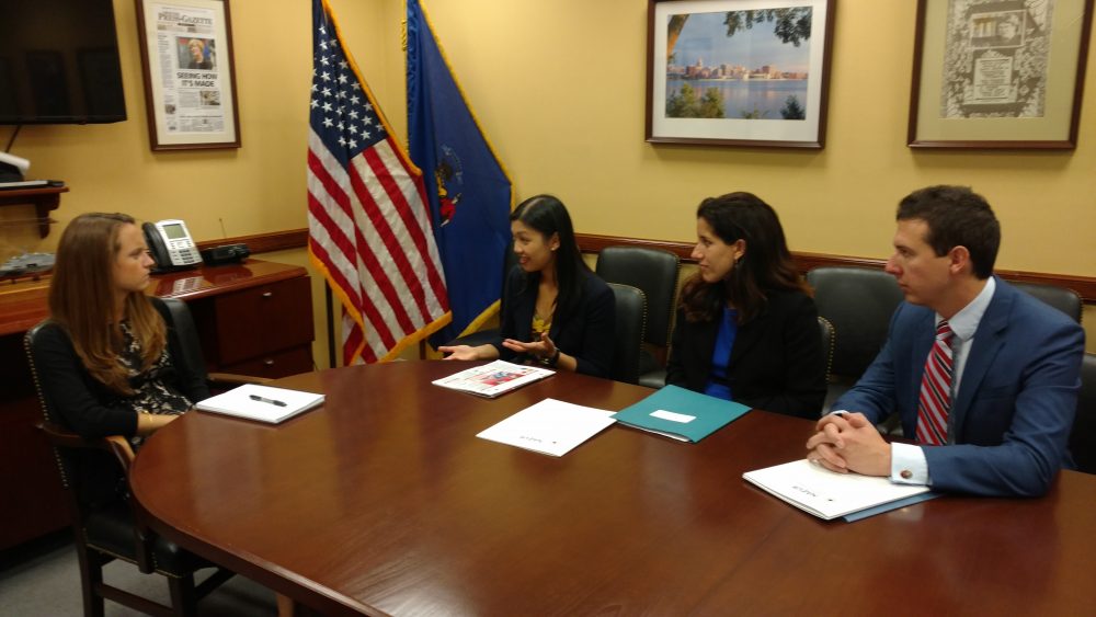 Yao Liu and Wisconsin representatives presenting project to Congressional representative
