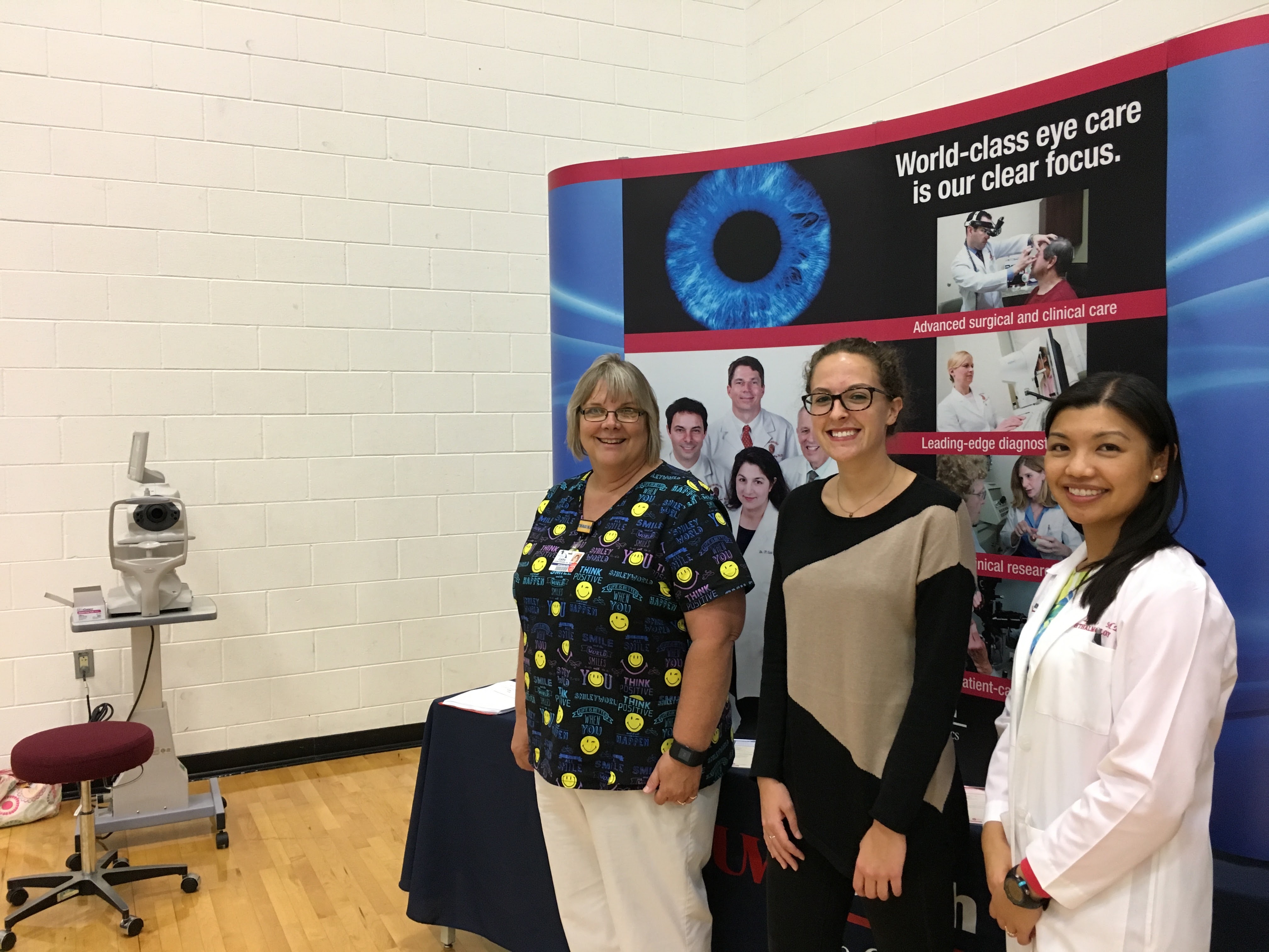 Dr. Liu and team at health fair booth